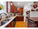 Spacious kitchen featuring wood cabinets, granite countertops, and stainless steel appliances at 14940 Carbert Ln, Huntersville, NC 28078