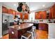 Kitchen island with seating and overhead pot rack at 14940 Carbert Ln, Huntersville, NC 28078