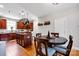 Kitchen boasts a large island, wood cabinets, and an adjacent dining area at 14940 Carbert Ln, Huntersville, NC 28078