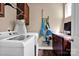 Bright laundry room features a washer, dryer, and ample cabinet space at 14940 Carbert Ln, Huntersville, NC 28078