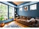 Cozy living room with large windows, stylish decor, and comfortable seating at 14940 Carbert Ln, Huntersville, NC 28078