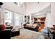 Cozy living room filled with natural light and hardwood floors at 14940 Carbert Ln, Huntersville, NC 28078