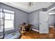 Functional home office space with natural light, hardwood floors and a comfortable work area at 14940 Carbert Ln, Huntersville, NC 28078