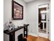 Entryway leading to a stylish half-bathroom with unique decor at 14940 Carbert Ln, Huntersville, NC 28078
