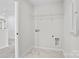 Functional laundry room with sleek tile flooring and connections for washer and dryer at 15004 Meadows Hunt Ln # 155, Huntersville, NC 28078