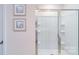 Close up of a bathroom glass enclosed shower with built in shelves at 151 Rustling Waters Dr, Mooresville, NC 28117