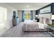 Spacious main bedroom with plush carpeting, a large window, and modern furnishings, offering a tranquil retreat at 151 Rustling Waters Dr, Mooresville, NC 28117