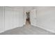 Carpeted bedroom featuring a closet and a view into the next room at 15108 Castlebridge Ln, Matthews, NC 28104