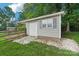 Exterior of detached garage featuring a single door and covered porch at 15108 Castlebridge Ln, Matthews, NC 28104