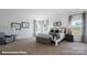 Spacious bedroom with natural light, comfortable seating, and stylish furnishings at 155 Rustling Waters Dr, Mooresville, NC 28117