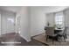 Dining room features wood floors, a dining table with seating, and ample natural light at 155 Rustling Waters Dr, Mooresville, NC 28117