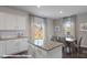 Open dining area with granite countertops and natural light from sliding glass doors at 155 Rustling Waters Dr, Mooresville, NC 28117