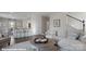Inviting living room with wood floors, a cozy couch, and access to dining and kitchen areas at 155 Rustling Waters Dr, Mooresville, NC 28117