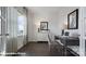 Comfortable study with dark wood floors, a desk, and a window offering natural light at 155 Rustling Waters Dr, Mooresville, NC 28117