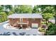 Brick home with a deck, garage, and landscaped backyard at 1602 Brentwood Dr, Newton, NC 28658