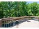 This spacious deck features a wooden railing and is perfect for entertaining or relaxing while enjoying the backyard view at 1602 Brentwood Dr, Newton, NC 28658