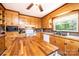 Traditional kitchen with wooden cabinets, tile backsplash, and modern appliances at 1602 Brentwood Dr, Newton, NC 28658