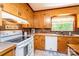 Bright kitchen features wooden cabinets, tile backsplash, and modern appliances at 1602 Brentwood Dr, Newton, NC 28658