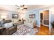 Cozy living room with hardwood floors, neutral-colored couches, and a ceiling fan at 1602 Brentwood Dr, Newton, NC 28658