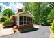 Exterior view of a brick home featuring a screened in porch at 1602 Brentwood Dr, Newton, NC 28658
