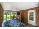Interior of a brick home featuring a screened porch with charming decor at 1602 Brentwood Dr, Newton, NC 28658