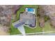 Aerial view of the home, in-ground pool, jacuzzi, walkway, and lush greenery at 17416 Gillican Overlook Rd, Davidson, NC 28036