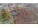 Aerial view of the home and lot, surrounded by lush greenery and neighborhood at 17416 Gillican Overlook Rd, Davidson, NC 28036