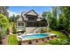 Expansive backyard with a stunning pool and hot tub combo, perfect for relaxing and entertaining at 17416 Gillican Overlook Rd, Davidson, NC 28036