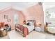 Cozy bedroom with sloped ceilings, textured walls, and charming decor at 17416 Gillican Overlook Rd, Davidson, NC 28036