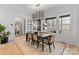 Bright dining area with stylish light fixture and large windows overlooking outdoor space at 17416 Gillican Overlook Rd, Davidson, NC 28036