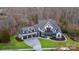 Stunning home with three car garage, manicured lawn and mature trees at 17416 Gillican Overlook Rd, Davidson, NC 28036