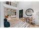 Grand foyer with an open floor plan, decorative mirror and convenient table and seating at 17416 Gillican Overlook Rd, Davidson, NC 28036