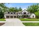 A beautiful two-story home with a three-car garage and manicured lawn in a well-developed neighborhood at 17416 Gillican Overlook Rd, Davidson, NC 28036