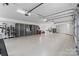 Spacious garage with ample storage, epoxy flooring, and organized equipment at 17416 Gillican Overlook Rd, Davidson, NC 28036