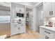 Modern kitchen features stainless steel appliances, white cabinets, and pantry access at 17416 Gillican Overlook Rd, Davidson, NC 28036