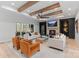 Spacious living room with beamed ceilings, fireplace and large glass sliding doors at 17416 Gillican Overlook Rd, Davidson, NC 28036