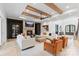 Spacious living room with beamed ceilings, fireplace and lots of natural light at 17416 Gillican Overlook Rd, Davidson, NC 28036