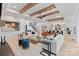 Open-concept living room featuring beamed ceilings, modern furniture and lots of light at 17416 Gillican Overlook Rd, Davidson, NC 28036