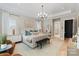 Spacious main bedroom with large windows, comfortable seating, and ensuite access at 17416 Gillican Overlook Rd, Davidson, NC 28036