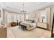 Serene bedroom with neutral tones, tray ceiling, and natural light at 17416 Gillican Overlook Rd, Davidson, NC 28036