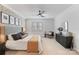 Spacious main bedroom with a cozy bed, decorative wall art, and ambient lighting creates a comfortable retreat at 17416 Gillican Overlook Rd, Davidson, NC 28036