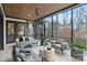 Relaxing screened porch with comfortable seating overlooking lush landscaping at 17416 Gillican Overlook Rd, Davidson, NC 28036