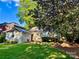 Backyard featuring a detached structure, green lawn and mature landscaping, perfect for outdoor living and entertaining at 1809 The Plaza None, Charlotte, NC 28205