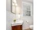 Charming bathroom featuring a decorative vanity, tiled walls, and natural light at 1809 The Plaza None, Charlotte, NC 28205