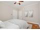Bedroom with hardwood floors, neutral walls, and a ceiling fan at 1809 The Plaza None, Charlotte, NC 28205