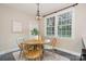 Cozy dining area featuring a round wooden table and natural light at 1809 The Plaza None, Charlotte, NC 28205