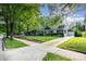 A lovely home with mature trees, a detached garage, and a well-maintained lawn at 1809 The Plaza None, Charlotte, NC 28205