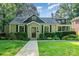 Charming home with a well-manicured lawn and stone walkway leading to the front door at 1809 The Plaza None, Charlotte, NC 28205