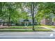 Charming house with mature trees, green lawn, and a well-maintained yard at 1809 The Plaza None, Charlotte, NC 28205