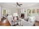 Bright living room featuring hardwood floors, a fireplace, and neutral decor at 1809 The Plaza None, Charlotte, NC 28205